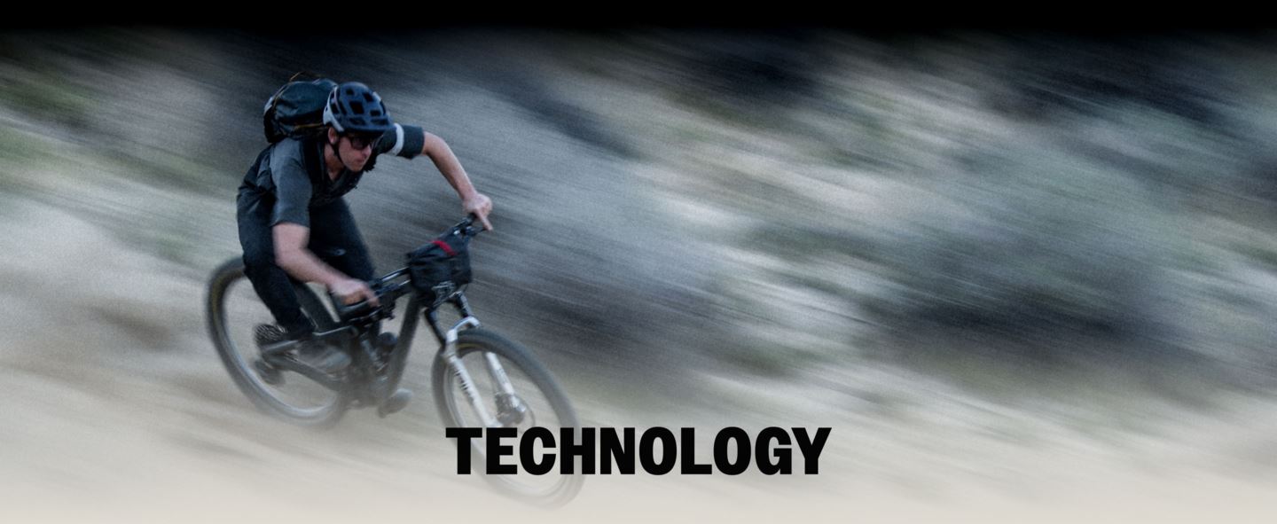 "Technology" text over motion blur image of MTB rider