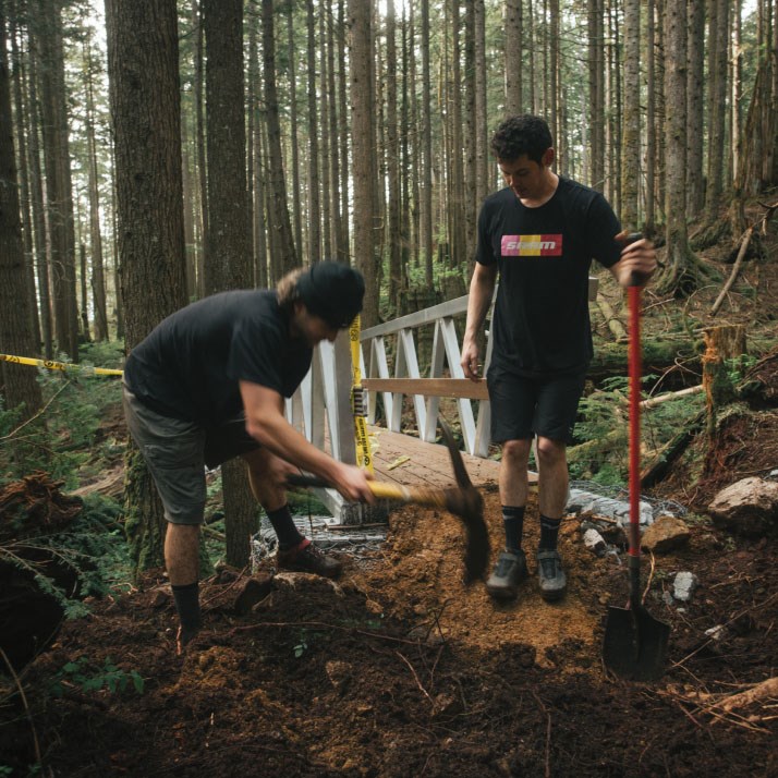 Volunteers working on building a mountain bike trail